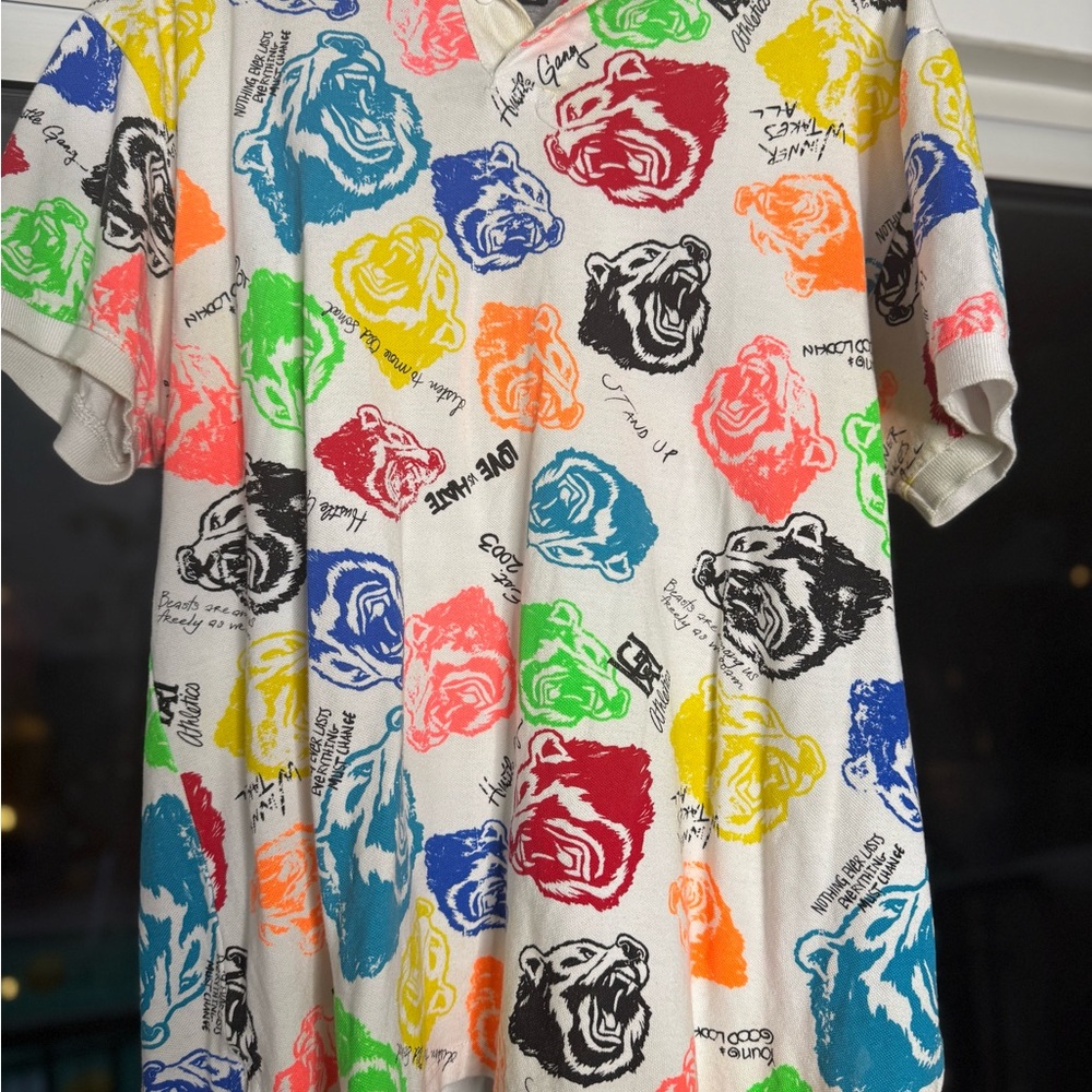 Hustle Gang white short sleeve polo with multi colored print